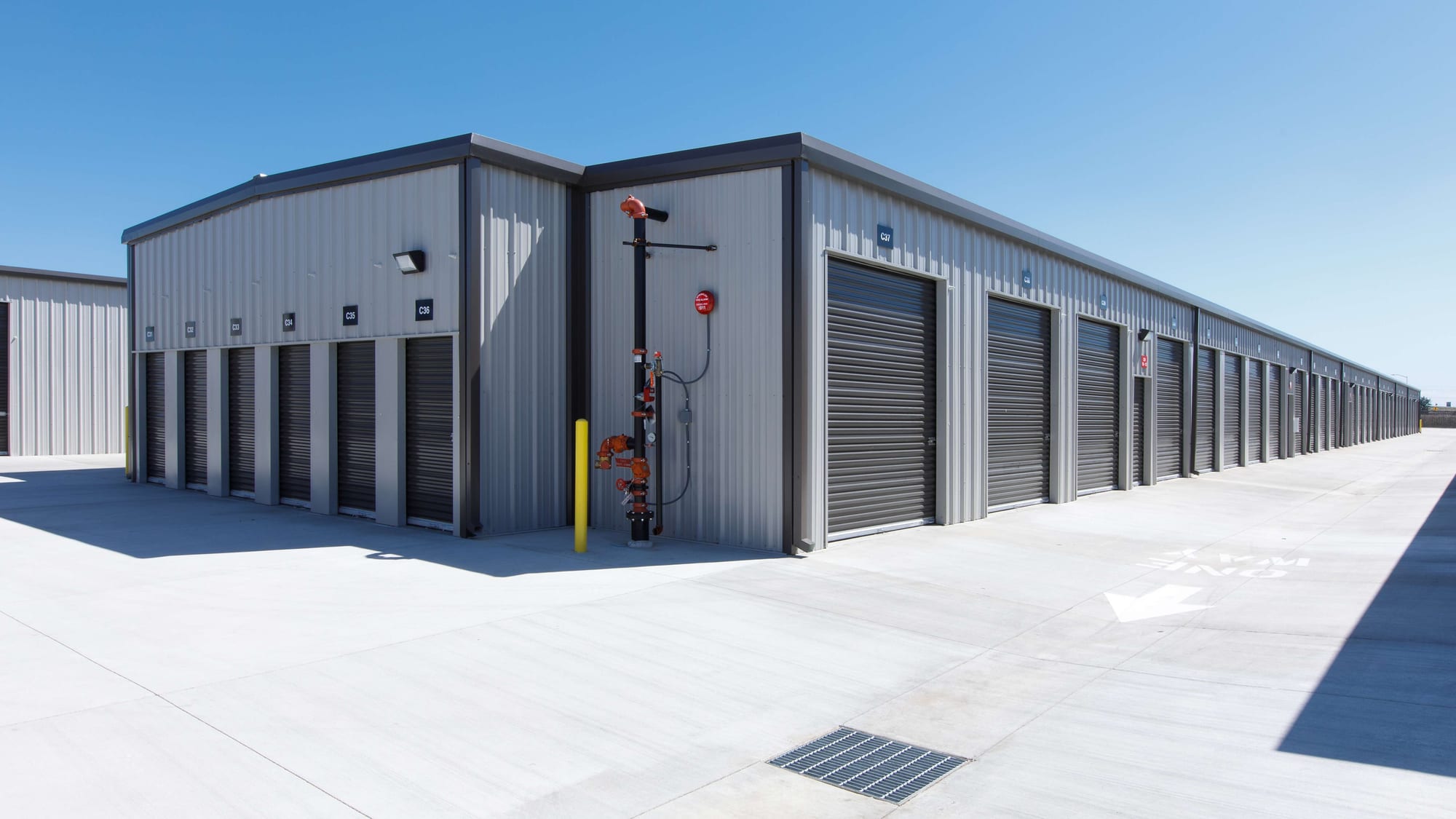 The corner of building C at Manteca Storage, where a row of small drive-up units meets a row of tall ones